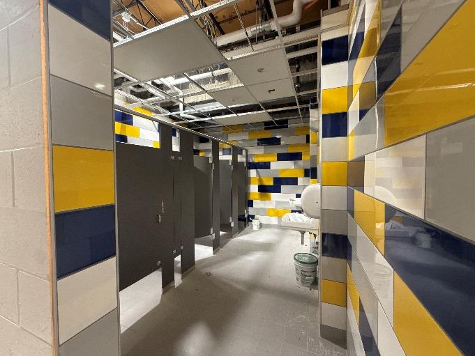 CHS - Auditorium Lobby Toilet Room Plumbing Fixtures in Progress